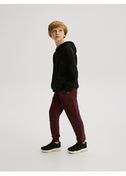 Reserved - Bawełniane joggery z meszkiem - bordowy ze sklepu Reserved w kategorii Spodnie chłopięce - zdjęcie 188470174