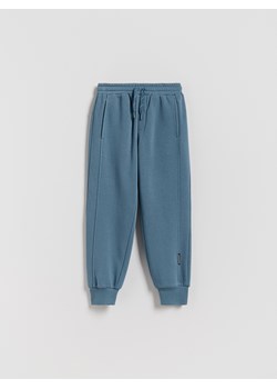 Reserved - Bawełniane joggery z meszkiem - niebieski ze sklepu Reserved w kategorii Spodnie chłopięce - zdjęcie 188470211