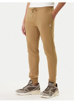 Polo Ralph Lauren Spodnie dresowe 710881518502 Beżowy Regular Fit ze sklepu MODIVO w kategorii Spodnie męskie - zdjęcie 188476770