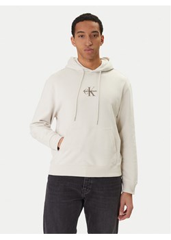 Calvin Klein Jeans Bluza LV04RD243G Beżowy Regular Fit ze sklepu MODIVO w kategorii Bluzy męskie - zdjęcie 188476820