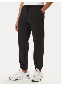 Guess Spodnie dresowe Z6RB09 KD472 Czarny Regular Fit ze sklepu MODIVO w kategorii Spodnie męskie - zdjęcie 188476862
