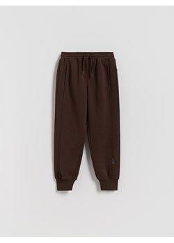Reserved - Bawełniane joggery z meszkiem - ciemnobrązowy ze sklepu Reserved w kategorii Spodnie chłopięce - zdjęcie 188481930
