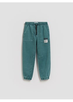 Reserved - Joggery z efektem sprania - morski ze sklepu Reserved w kategorii Spodnie chłopięce - zdjęcie 188482021