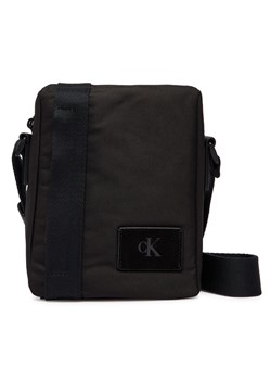 Calvin Klein Saszetka Canvas Mix Reporter LV04D3366G Czarny ze sklepu MODIVO w kategorii Torby męskie - zdjęcie 188513391