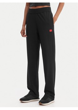 HUGO Spodnie dresowe Signature 50556808 Czarny Regular Fit ze sklepu MODIVO w kategorii Spodnie damskie - zdjęcie 188515101
