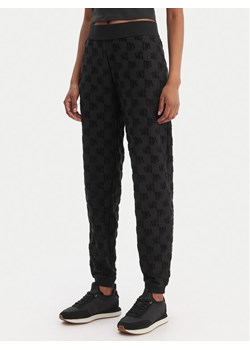 HUGO Spodnie dresowe Monogram 50556809 Czarny Regular Fit ze sklepu MODIVO w kategorii Spodnie damskie - zdjęcie 188515373