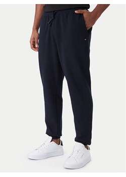 Tommy Hilfiger Spodnie dresowe Essential MW0MW37236 Granatowy Regular Fit ze sklepu MODIVO w kategorii Spodnie męskie - zdjęcie 188515484