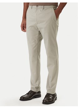 Calvin Klein Chinosy LV04LD613G Beżowy Slim Fit ze sklepu MODIVO w kategorii Spodnie męskie - zdjęcie 188515904