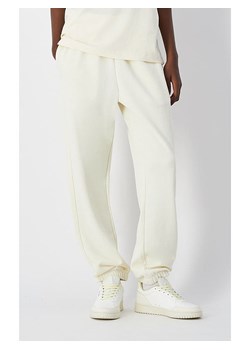 Champion Spodnie dresowe w kolorze kremowym ze sklepu Limango Polska w kategorii Spodnie damskie - zdjęcie 188626660