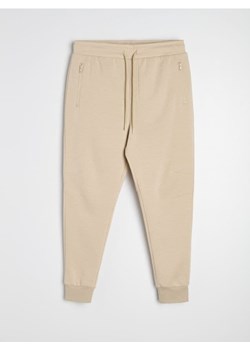 Sinsay - Spodnie dresowe jogger - beżowy ze sklepu Sinsay w kategorii Spodnie męskie - zdjęcie 188696611