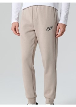 Sinsay - Spodnie dresowe jogger - beżowy ze sklepu Sinsay w kategorii Spodnie męskie - zdjęcie 188696612
