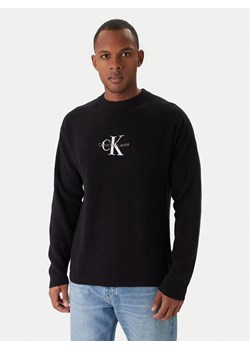 Calvin Klein Jeans Sweter J30J322460 Czarny Loose Fit ze sklepu MODIVO w kategorii Swetry męskie - zdjęcie 188717291