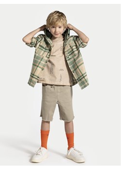 Coccodrillo Szorty materiałowe WC4123301HBJ Beżowy Regular Fit ze sklepu MODIVO w kategorii Spodenki chłopięce - zdjęcie 188728512
