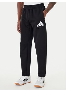 adidas Spodnie dresowe Future Icons 3 Bar JZ9399 Czarny Regular Fit ze sklepu MODIVO w kategorii Spodnie męskie - zdjęcie 188758471