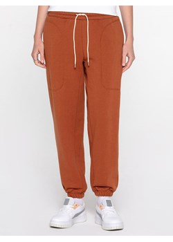 Puma Spodnie dresowe "Infuse" w kolorze jasnobrązowym ze sklepu Limango Polska w kategorii Spodnie damskie - zdjęcie 188807011