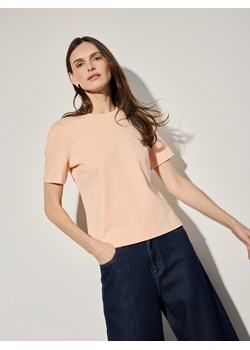 Mohito - Brzoskwiniowy t-shirt z merceryzowanej bawełny - brzoskwiniowy ze sklepu Mohito w kategorii Bluzki damskie - zdjęcie 188826673