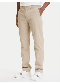 Tommy Hilfiger Chinosy Denton Essential MW0MW40262 Beżowy Straight Fit ze sklepu MODIVO w kategorii Spodnie męskie - zdjęcie 188967552