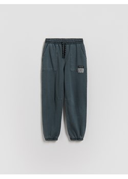 Reserved - Joggery z efektem sprania - granatowy ze sklepu Reserved w kategorii Spodnie chłopięce - zdjęcie 188997223