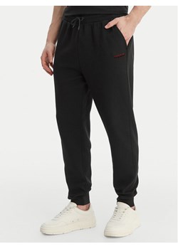 HUGO Spodnie dresowe Atlas 50557004 Czarny Regular Fit ze sklepu MODIVO w kategorii Spodnie męskie - zdjęcie 189056283