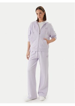 Calvin Klein Jeans Spodnie dresowe Embossed Monologo LV047F206G Różowy Regular Fit ze sklepu MODIVO w kategorii Spodnie męskie - zdjęcie 189056521