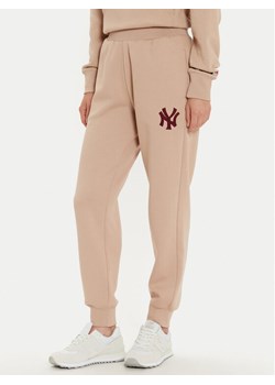 Champion Spodnie dresowe 117510 Beżowy ze sklepu MODIVO w kategorii Spodnie damskie - zdjęcie 189073293