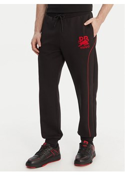 HUGO Spodnie dresowe Dusson_RB 50559707 Czarny Relaxed Fit ze sklepu MODIVO w kategorii Spodnie męskie - zdjęcie 189079254