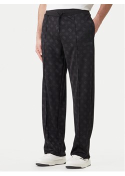 Guess Spodnie dresowe Z6GB03 K2850 Czarny Regular Fit ze sklepu MODIVO w kategorii Spodnie męskie - zdjęcie 189101802