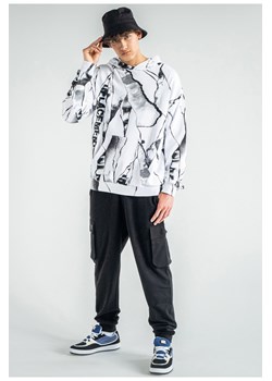 Czarne spodnie dresowe LOOSE z przestrzennymi kieszeniami, Rozmiar - 140, Kolor - Czarny ze sklepu REPORTER w kategorii Spodnie chłopięce - zdjęcie 189107333