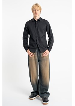 Granatowe spodnie jeansowe o kroju BAGGY z efektem sprania, Rozmiar - 176, Kolor - Granatowy ze sklepu REPORTER w kategorii Spodnie chłopięce - zdjęcie 189110312