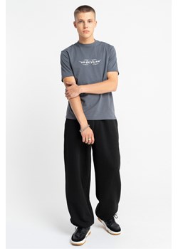 Czarne spodnie dresowe OVERSIZE z regulacją szerokości dołu, Rozmiar - 146, Kolor - Czarny ze sklepu REPORTER w kategorii Spodnie chłopięce - zdjęcie 189110573