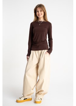 Kremowe spodnie materiałowe BAGGY z zakładkami, Rozmiar - 146, Kolor - Beżowy ze sklepu REPORTER w kategorii Spodnie dziewczęce - zdjęcie 189110803