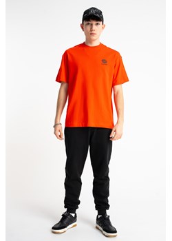 Czarne spodnie dresowe SLIM z minimalistycznym nadrukiem, Rozmiar - 140, Kolor - Czarny ze sklepu REPORTER w kategorii Spodnie chłopięce - zdjęcie 189110972