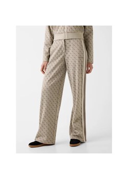 GUESS ACTIVE Spodnie dresowe 4G | Relaxed fit ze sklepu Gomez Fashion Store w kategorii Spodnie damskie - zdjęcie 189135363