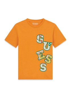 Guess T-Shirt L6GI02 K8HM4 Pomarańczowy Relaxed Fit ze sklepu MODIVO w kategorii T-shirty chłopięce - zdjęcie 189135584