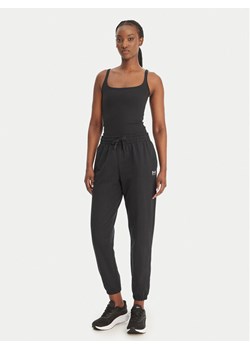 Under Armour Spodnie dresowe Sport Terry 6011020 Czarny Regular Fit ze sklepu MODIVO w kategorii Spodnie damskie - zdjęcie 189144000