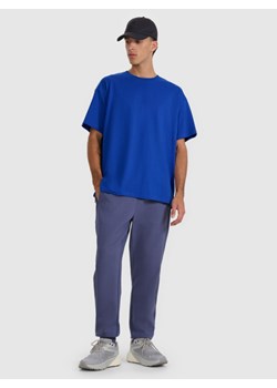 Męskie spodnie dresowe joggery 4F 4FWAW25TTROM1252 - granatowe ze sklepu Sportstylestory.com w kategorii Spodnie męskie - zdjęcie 189146443