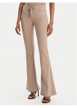 Juicy Couture Spodnie dresowe Christine JCWBJ126309 Beżowy Flared Leg ze sklepu MODIVO w kategorii Spodnie damskie - zdjęcie 189274013
