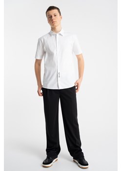 Czarne spodnie garniturowe REGULAR, Rozmiar - 140, Kolor - Czarny ze sklepu REPORTER w kategorii Spodnie chłopięce - zdjęcie 189316992