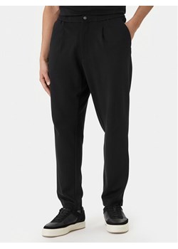 Calvin Klein Spodnie materiałowe LV04LF607G Czarny Tapered Fit ze sklepu MODIVO w kategorii Spodnie męskie - zdjęcie 189367091